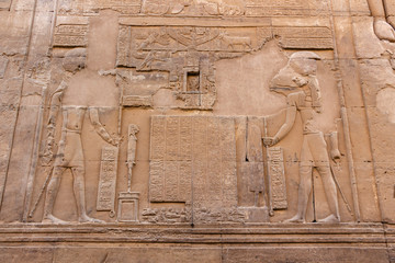 The Egyptian falcon god Horus and Sobek detail on the wall in the Temple of Kom Ombo