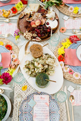 A table set with food and beautiful styling awaiting guests to arrive