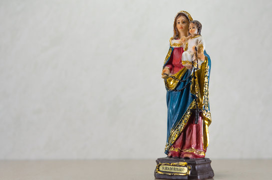 Image of Catholic saints where Our Lady of the Rosary appears on a light background