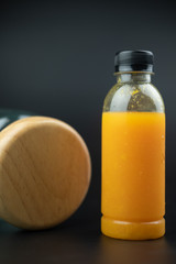 One plastic bottle with orange juice