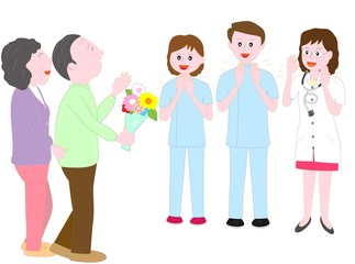 高齢者の退院を見送る医者と看護師