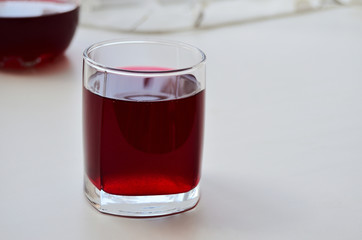 glass glass with blackcurrant juice on the window
