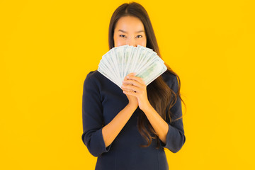 Portrait beautiful young asian woman with money and cash