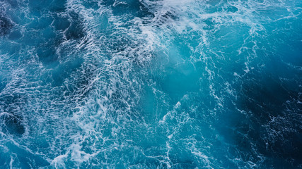 Abstraction of sea foam in the ocean. Dark water, storm waves