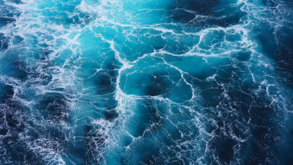 Abstraction of sea foam in the ocean. Dark water, storm waves
