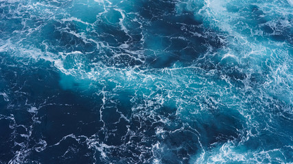 Abstraction of sea foam in the ocean. Dark water, storm waves