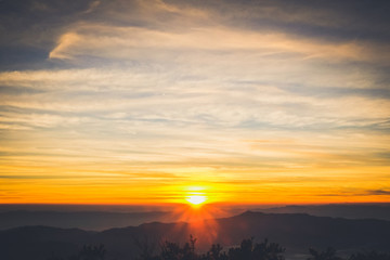 sunrise backlit sky with cloud on the top of mountain