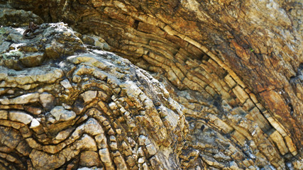 Stone texture, abstract background, uneven lines, bends of stone layers. Natural pattern for your product. wavy structure of layers of stone