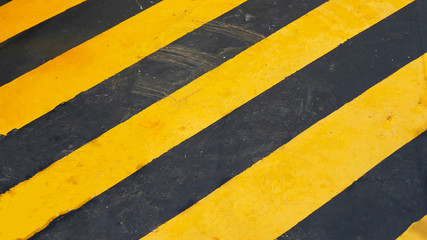 warning striped rectangular background, yellow and black stripes. old paint grunge . attention area diagonal stripes 