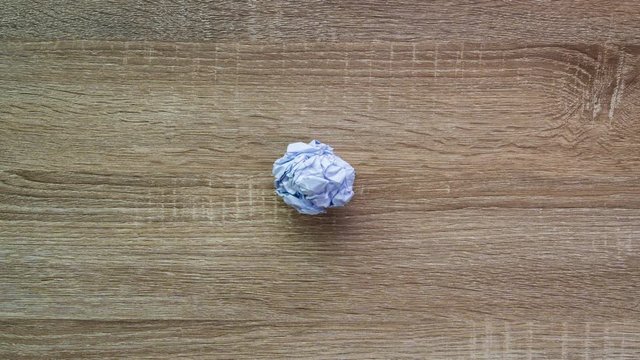Stop Motion animation video The scene of the paper sheet is a ball and a paper unfolding scene business concept and idea concept in top view shot in Apple Proress 422(HQ) 4096x2304 resolution.