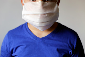 boy wearing protective medical mask
