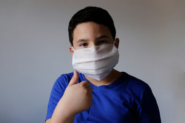 boy wearing protective medical mask