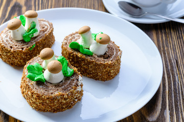 three tender cakes with mushrooms on a white plate