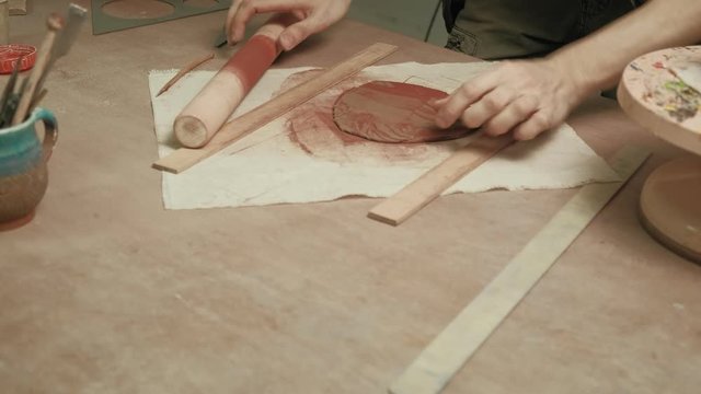 Ceramist work in the workshop.