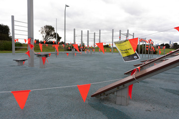 Outdoor Gym temporary closure due to Covid-19 warning sign and flags. 