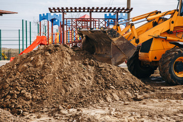 The tractor digs and buries a trench. Concept of the tractor