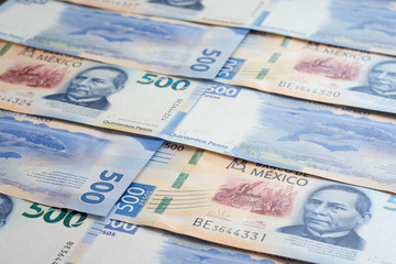 Mexican 500 pesos pile of blue bucks stack on top left