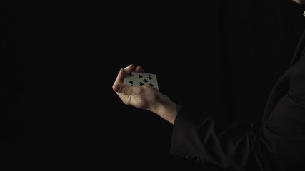 Magician Performing Card Trick. Change the color of the card. Close up
