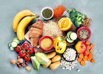 Foods high in carbohydrates on grey background