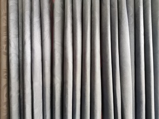 gray velvet textile curtains background. old blinds background