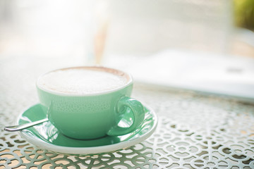 Hot coffee cup on white table