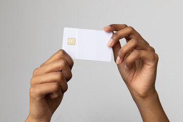 Mockup - Woman of color holding a blank credit card