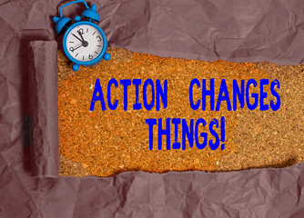Writing note showing Action Changes Things. Business concept for start doing something against...