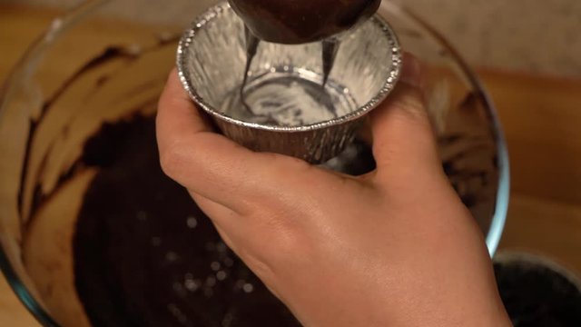 Close up shot of chocolate ice cream scoop in chocolate chip cookie sandwich