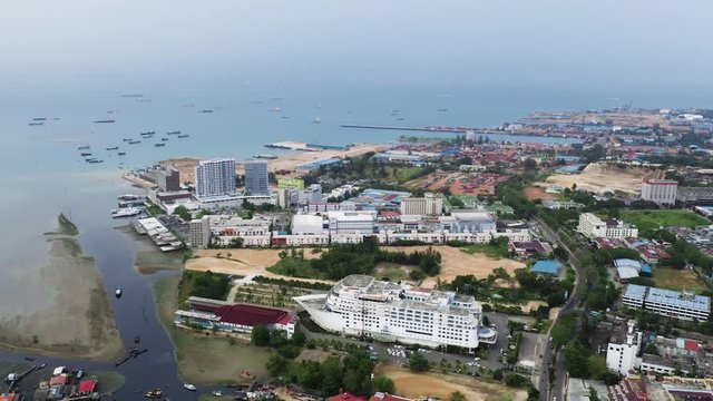 Aerial View Of Batam Island, Indonesia Composed Of Different Buildings and Trees With Calm Sea - Aerial Shot