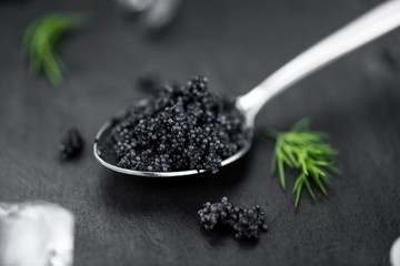 Slate slab with Black Caviar (selective focus; close-up shot)
