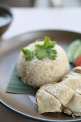 Thai food gourmet steamed chicken with rice , khao mun kai in wood background