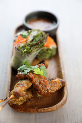 Chicken Satay on wood background