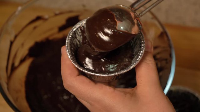 Close up shot of chocolate ice cream scoop in chocolate chip cookie sandwich slow motion