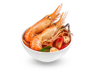Tom Yum Gong.Thai hot and spicy soup shrimp in bowl.with Straw Mushroom,lime,Kaffir lime leaves,tomato and chilli. Tom Yum Gong Spicy Sour Soup isolated on white background .Thai traditional Food.