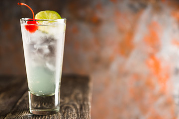 Rum collins cocktail (variation of traditional Tom collins). Selective focus. Shallow depth of field.