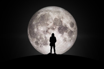 Silhouette of man  Looking at the moon with hope Fulfillment in love. Elements of this image...