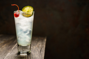 Rum collins cocktail (variation of traditional Tom collins). Selective focus. Shallow depth of field.