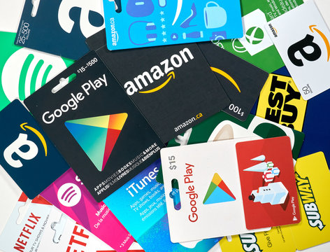 Different gift cards of many brands such as Amazon, Netflix, Xbox, Google Play, Best Buy, Spotify