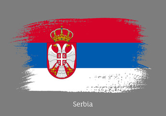 Fototapeta premium Serbia official flag in shape of paintbrush stroke. Serbian national identity symbol. Grunge brush blot object isolated on white background vector illustration. Serbia country patriotic stamp.
