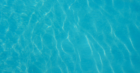 Blue water wave texture in swimming pool