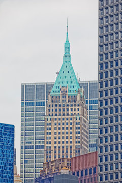 40 Wall Street - The Trump Building During The Gloomy Weather From The Staten Island Ferry In New York.