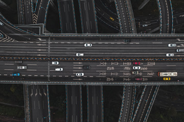 Aerial overhead shot of flyover to E'gongyan Bridge traffic before dawn in Chongqing, China