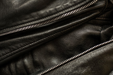 black leather texture with
and metallic zipper for clothing