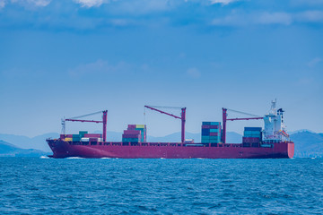 Fototapeta premium The Container ship business import export logistic and transportation by container ship with blue sky background.