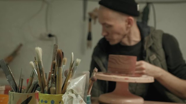 Ceramist work in the workshop.