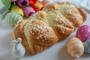 Home made sweet braided bread on a wooden board