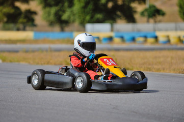 Young go cart racer on circuit