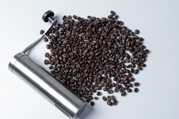 Coffee grinder And coffee beans placed on a white background.