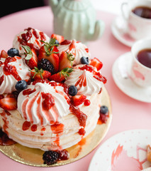 cake with different berries and cream