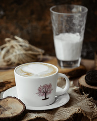 cappuccino and glass of milk on the table